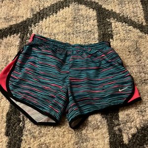 Black, pink and blue Nike shorts